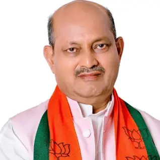 Formal portrait of Manmohan Samal wearing a Bharatiya Janata Party scarf.